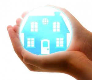hands holding a house