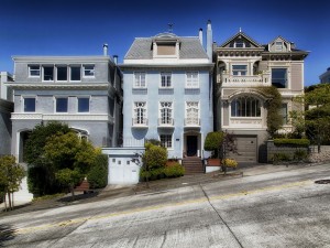 three houses on a hill